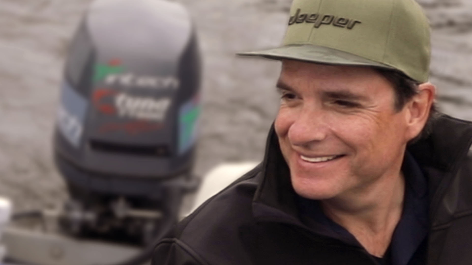 Mike D smiling aboard a fishing boat